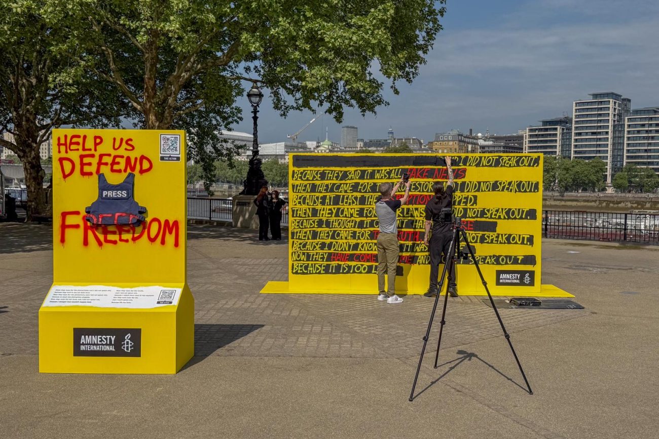 An installation from Amnesty International, featuring a statement adapted from Martin Niemoller's famous quote, is unveiled at South Bank on the eve of World Press Freedom Day, highlighting the increasing global threats to press freedom. 124 journalists were killed in 2024, the majority during Israel's attacks on Gaza.